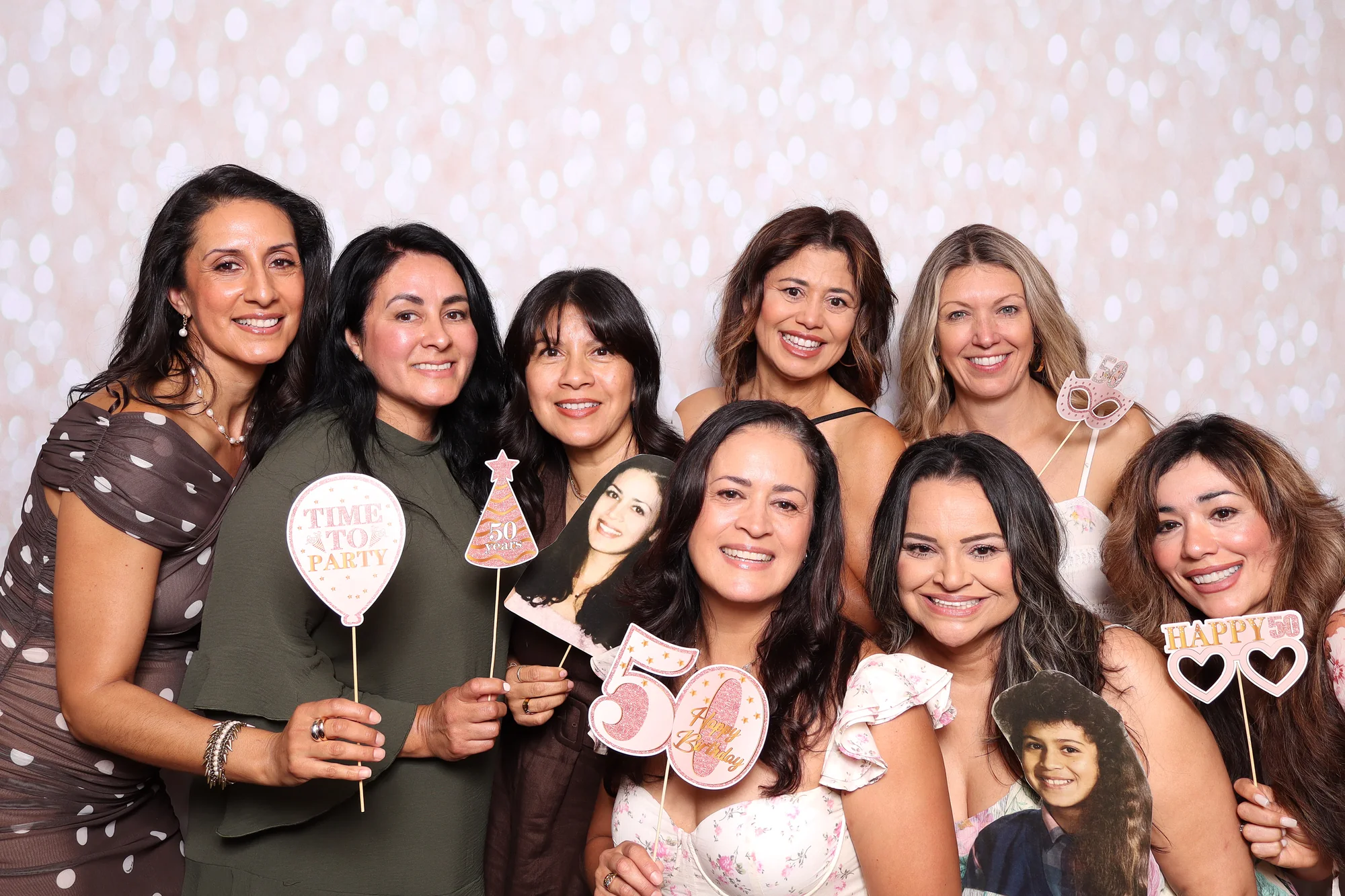 Guests celebrating a milestone birthday at a RicheMoments photo booth